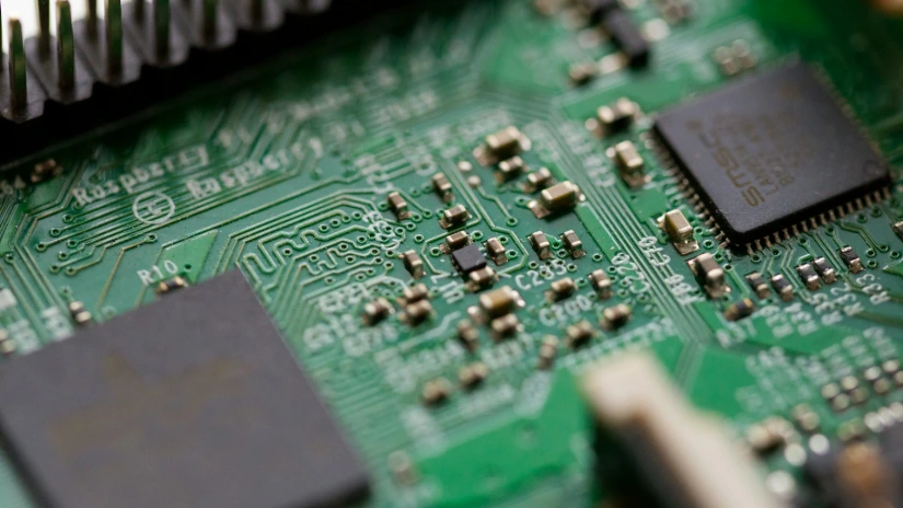 tilt-shift photography of green computer motherboard